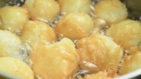 Close-up of donuts fried in boiling sunflower oil. 스톡 동영상 169799975