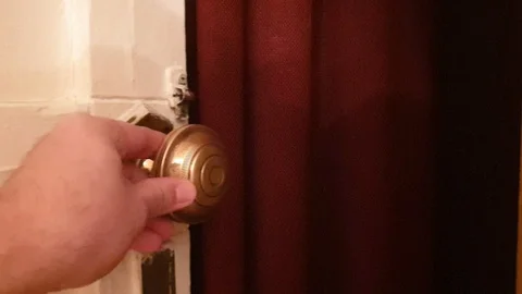 Close the door with an antique handle Stock Footage 122379694