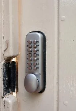 Close up of door lock metal code numbers protection Stock Photos