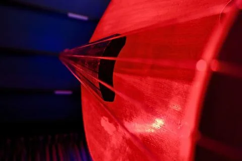 Close-Up of Double Bass Strings with Red and Blue Dramatic Lighting Foto stock
