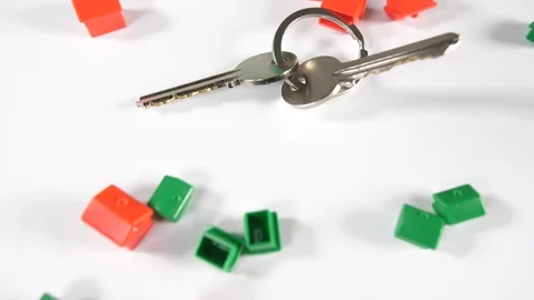 Close up of double dice and red and green game playing pieces with new house  Stock Footage 89188348