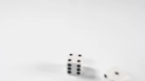 Close up of double dice thrown onto a white surface background, above macro Stock Footage 89188374