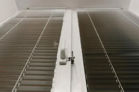 Close-up of double-glazed plastic window frame, one-way kitchen window handle Stock Photos