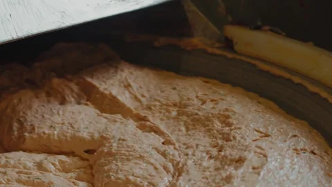 Close-up of dough on a kneading machine in motion Stock Footage 298029715