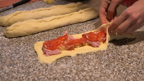 Close the dough to make a stuffed bread Stock Footage 85309910