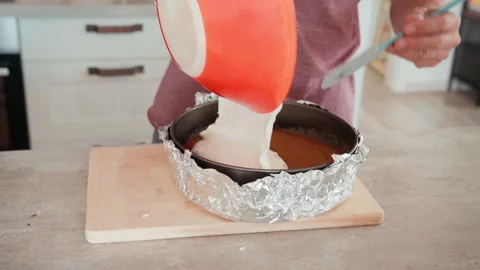 Close Up of Dough Poured into Baking Form for Apple Cake Stock Footage 347899659