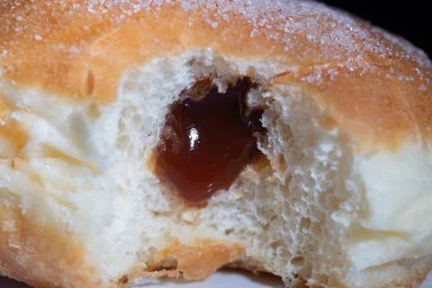 Close-up of a doughnut filled with jam Foto stock