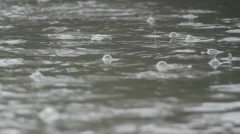 Close up of downpour by lake Stock Footage 11520216