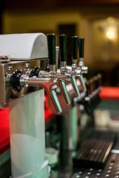 Close up draft beer and lemonade dispensing tower of bar restaurant Stock Photos