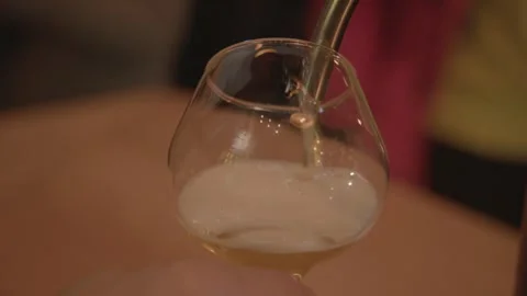 Close-Up of Draft Beverage Being Poured Into Glass at Bar in Beijing, China Stock Footage 345755080
