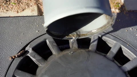 Close-up of drainpipe. Water flowing from gutter or drain into drainage system. Video stock 239273366