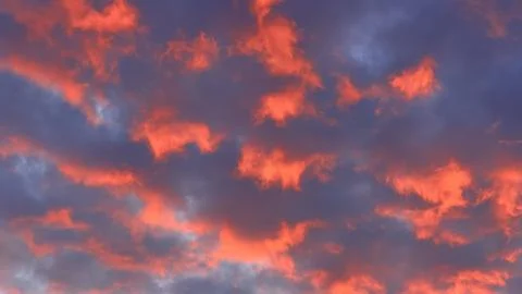 Close-up of a dramatic sunset sky showing vivid scattered clouds strongly 스톡 사진