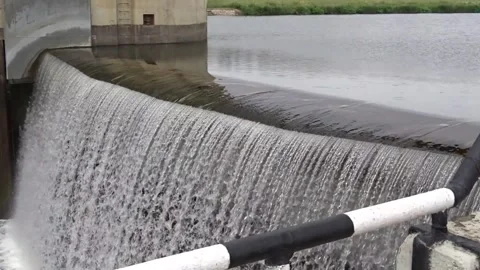 Close dramatic view of water spilling over dam gate Stock Footage 336203172