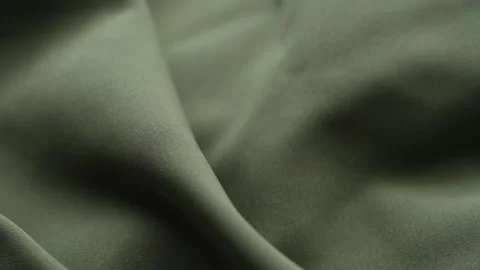 Close-up of a draped olive green fabric texture Stock Footage 344583099