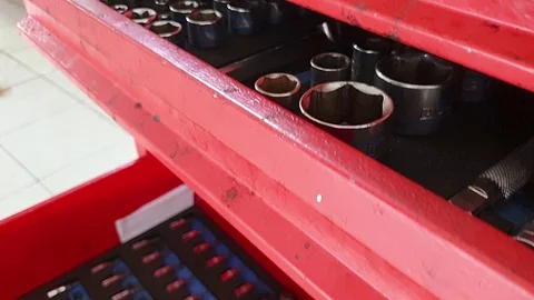 Close-up of drawers for instruments with open boxes, which are screwdrivers Stock-Footage 122641134