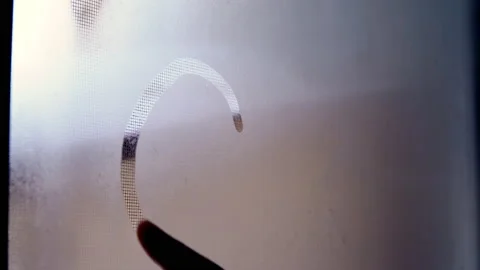 Close-up drawing of heart with finger on misted window Stock Footage 149222016