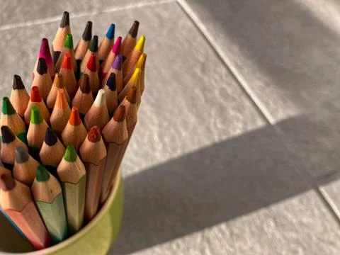 Close-up of drawing pencils that stand in a green cup. Stock Photos