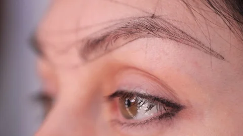 Close-up of a drawn eyebrow on points. Preparing for permanent makeup. Beauty Video stock 106891732