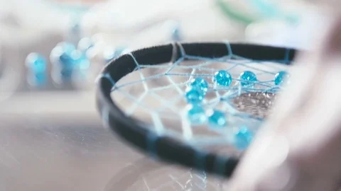 Close-up of Dreamcatcher black thread and turquoise beads Video stock 72971118