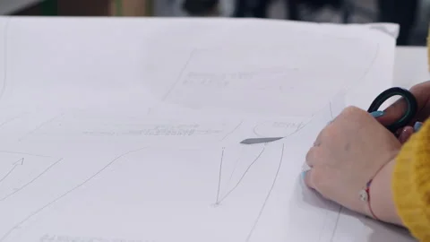 Close-up of the dressmaker's hands working with scissors. Tailor at work. The Video stock 131064097