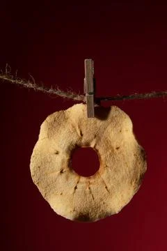 Close-up of a dried apple on a rope. vertically. Stock Photos
