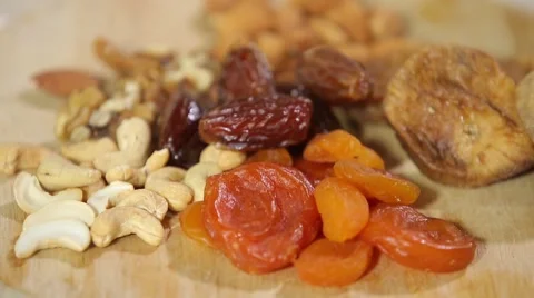 Close-up of dried apricots figs, dates, almonds cashew Stock Footage 67455065