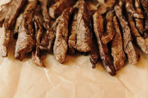 Close-up of dried beef lung strips prepared as natural dog treats. Healthy .. Stock Photos