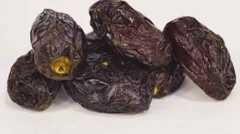 Close-Up of Dried Dates Isolated on White Background Stock Photos