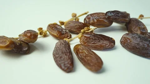 Close-up of Dried Dates on White Background, Close-up of dried dates on a w.. Stock Footage 304974443