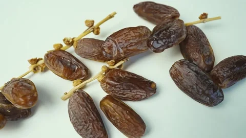 Close-up of Dried Dates on White Background, Close-up of dried dates on a w.. 動画素材 304974476