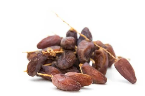 Close up of dried dates  on white background Stock Photos