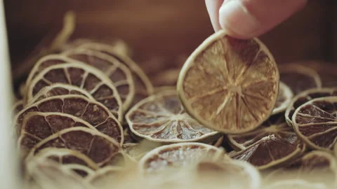 Close up of dried lime slice being handled. Dehydrated fruit Stock Footage 150798936