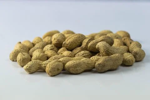 Close up of dried peanuts on a white background Stock Photos