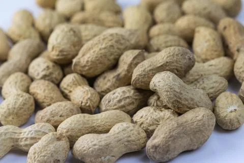 Close up of dried peanuts on a white background Stock Photos