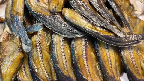Close-Up of Dried Smoked Fish Displayed at Asian Market Stall Video stock 329369233