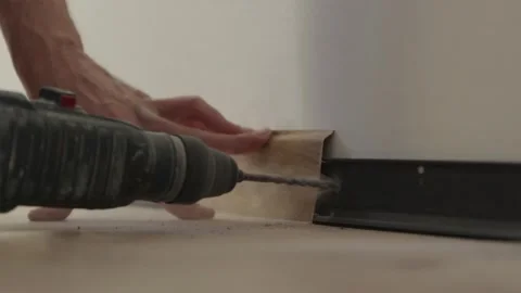 Close up of drill bit boring hole into concrete wall Stock Footage 346159772