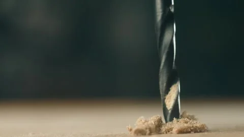 Close-up drill bit boring into wooden board during construction. Macro view Stock Footage 309328149