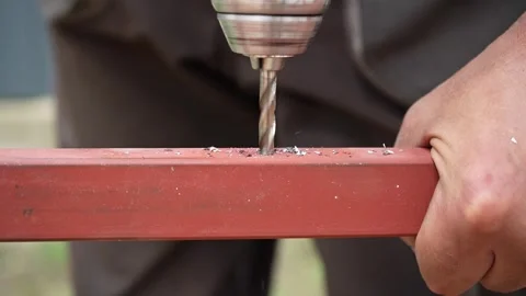 Close up of Drill bit Drilling into metal Pipe Stock Footage 258645869