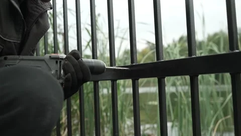 Close up of Drill bit Drilling into metal Pipe. Drilling a hole in the pipe Stock Footage 259037332