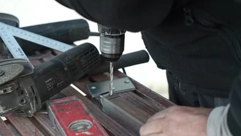 Close up of Drill bit Drilling into metal Pipe. Drilling a hole in the pipe Stock Footage 259037396
