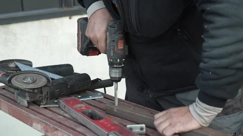 Close up of Drill bit Drilling into metal Pipe. Drilling a hole in the pipe Stock Footage 259037406
