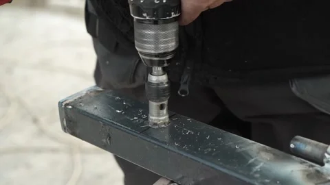 Close up of Drill bit Drilling into metal Pipe. Drilling a hole in the pipe Stock Footage 259037458