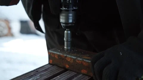 Close up of Drill bit Drilling into metal Pipe Stock Footage 263294926