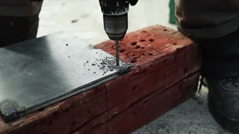 Close up of Drill bit Drilling into metal Pipe Stock Footage 269495230