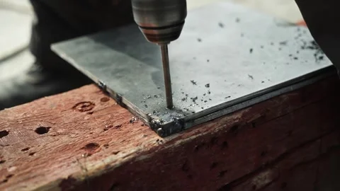 Close up of Drill bit Drilling into metal Pipe Stock Footage 269495261