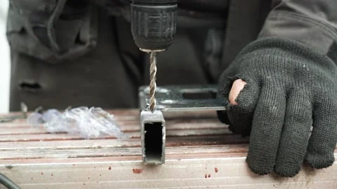 Close up of Drill bit Drilling into metal Pipe Stock Footage 269495298