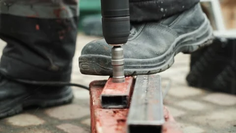 Close up of Drill bit Drilling into metal Pipe Stock Footage 274530415