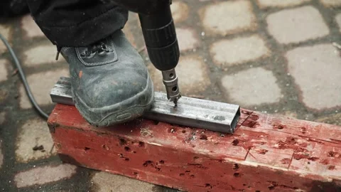 Close up of Drill bit Drilling into metal Pipe Stock Footage 274530434