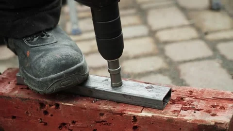 Close up of Drill bit Drilling into metal Pipe Stock Footage 274530435