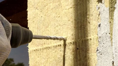 Close-up of a drill drills a wall Stock Footage 162654978